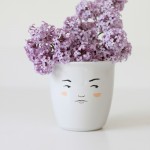 MUG-WITH-FACE-ON-IT-WITH-LILACS