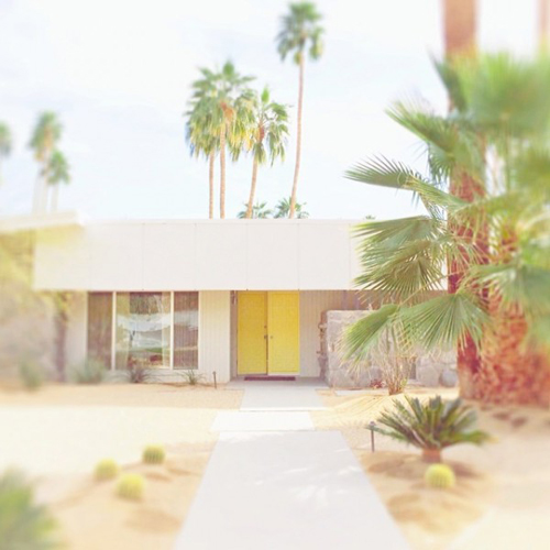 Palm Springs mid century home with yellow door