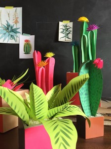 Colorful paper plants in a grey room