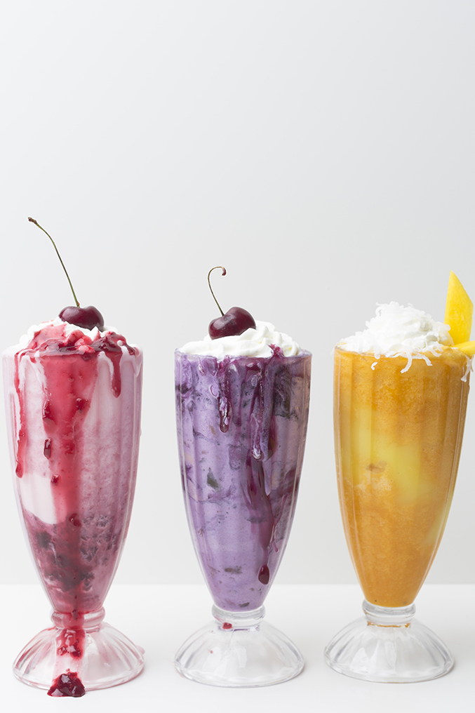 colorful ice cream sundaes in pink, purple, and yellow