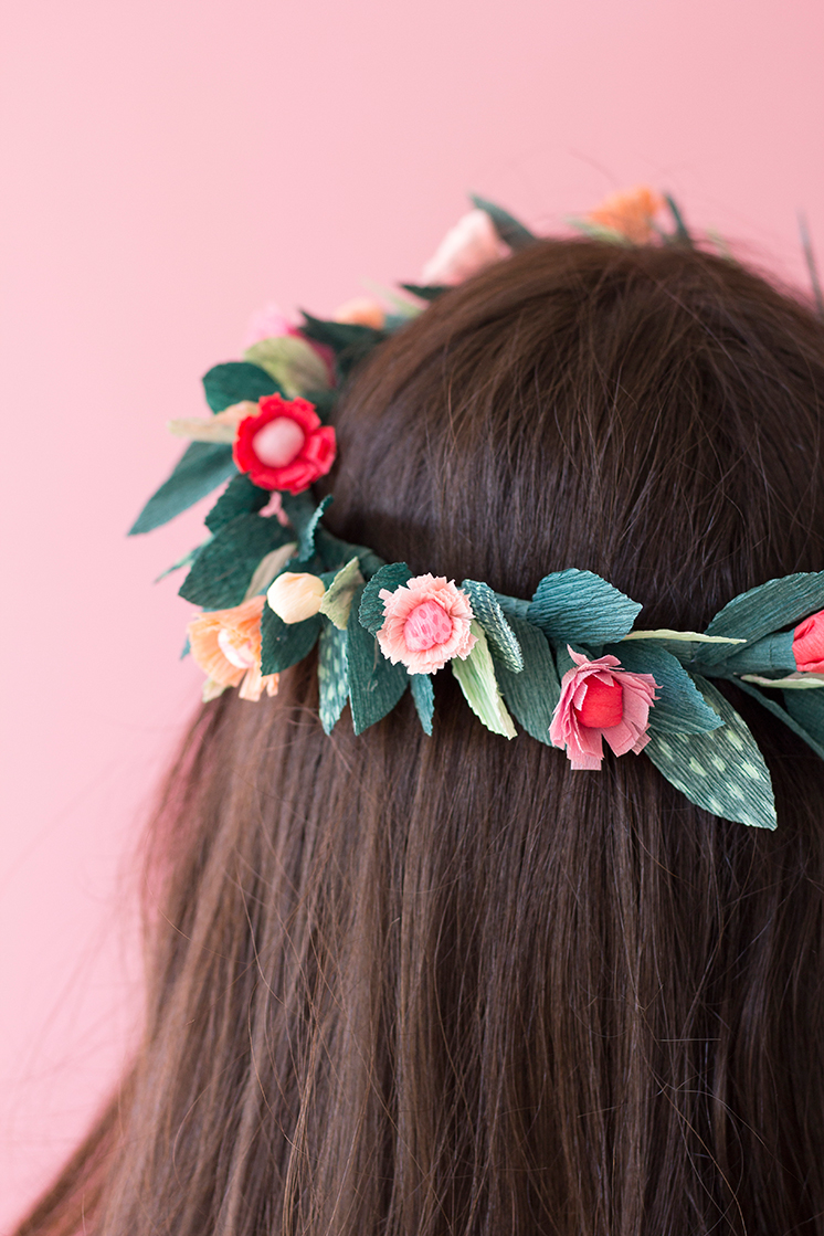 a floral crown on long, straight brown hair