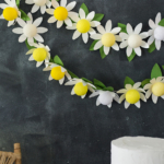 DIY paper daisy string lights by The House That Lars Built