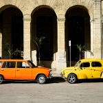 travel-to-cuba-orange-yellow-cars