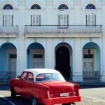 travel-to-cuba-red-cab