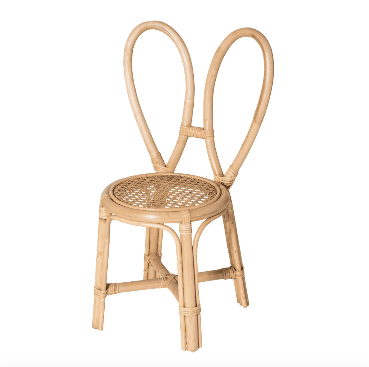 A rattan chair whose back is designed to look like bunny ears in a white space.