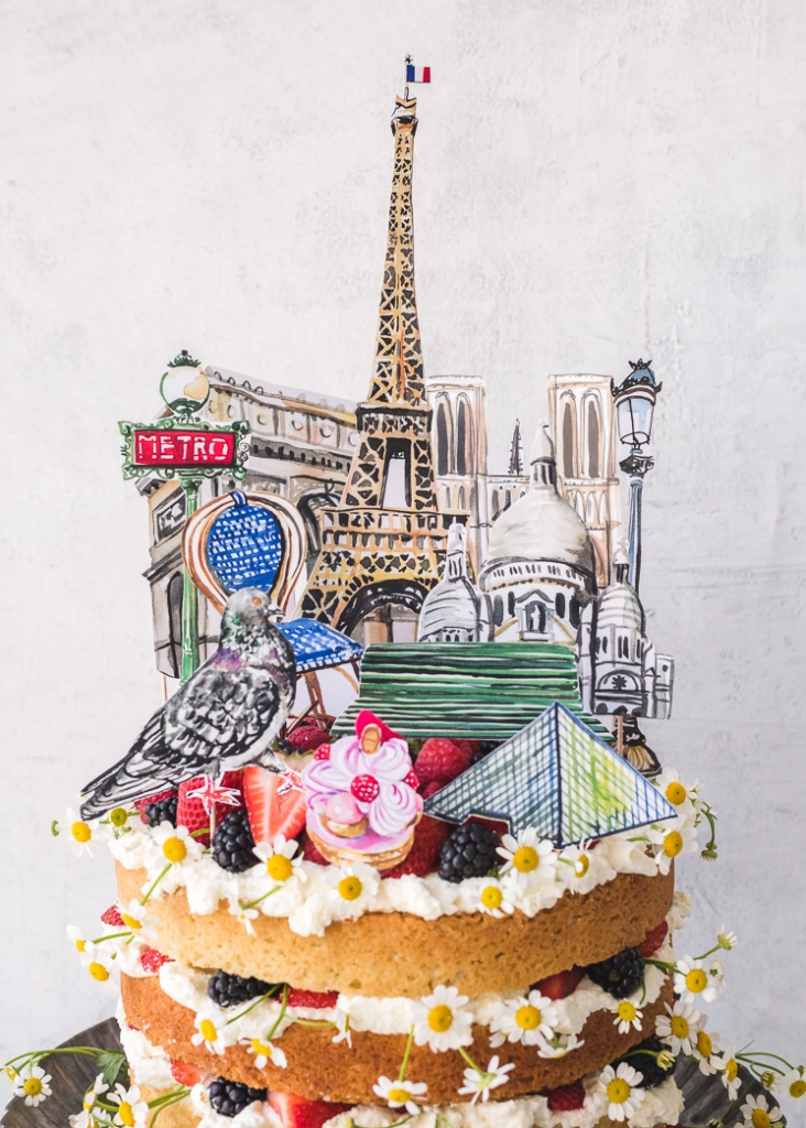 Paris cake topper with watercolor illustrations on a summer cake with flowers and berries