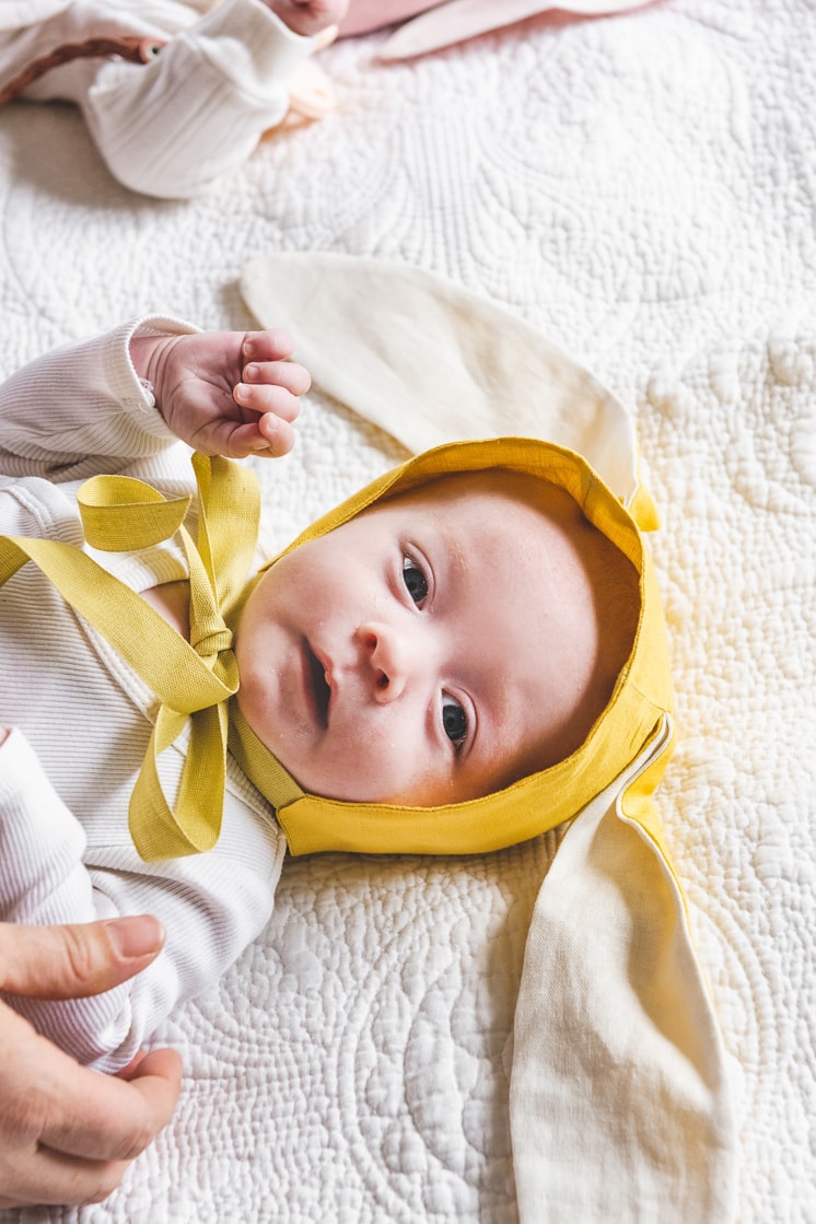 newborn twin boy in baby bonnet for easter