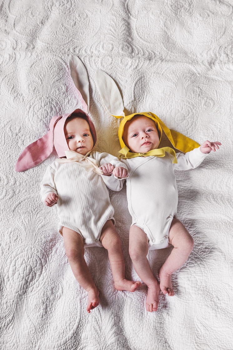 twins wearing baby bonnets