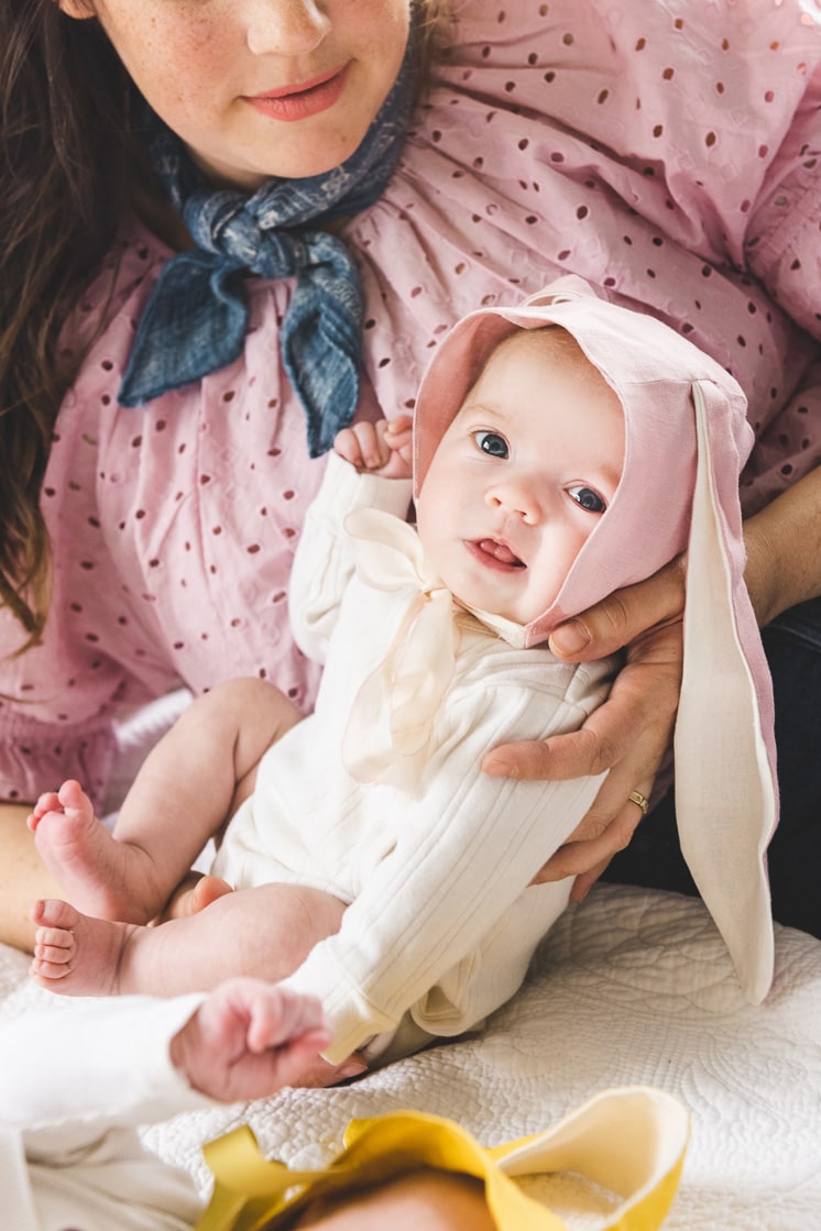 newborn baby girl in baby bonnet