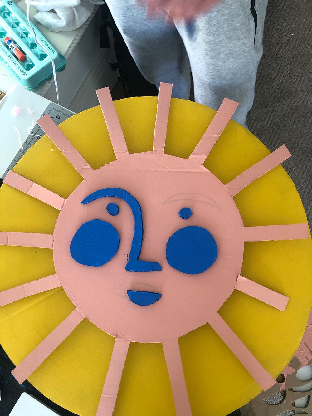 make a cardboard sun with recycled materials