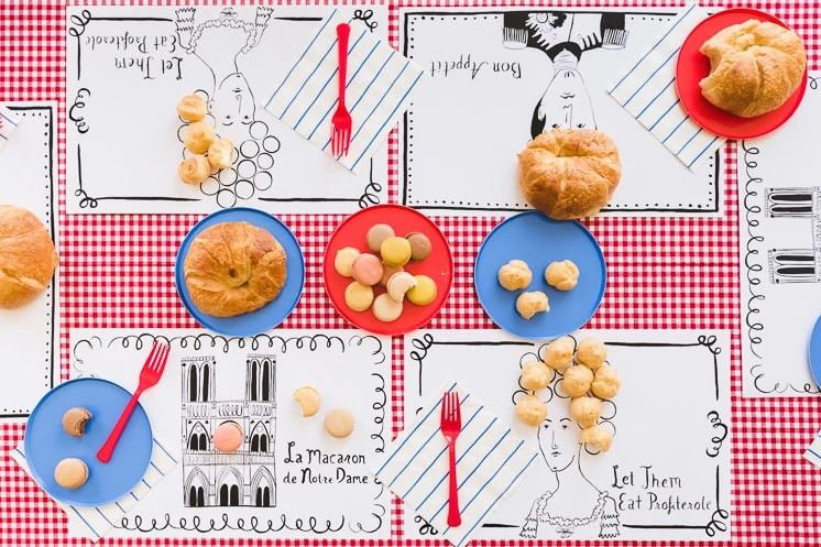 French placemats sit on a festive table.