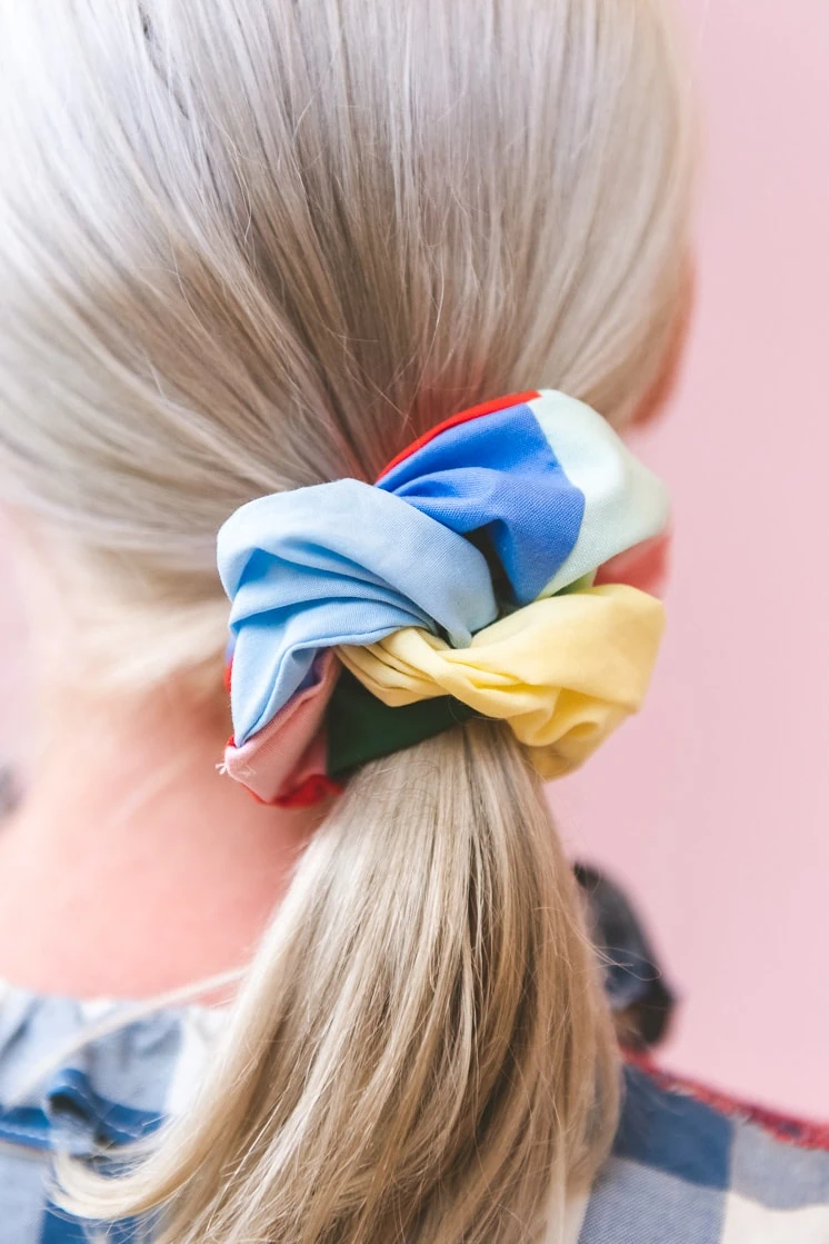 Brittany wearing a patchwork scrunchie in her hair.