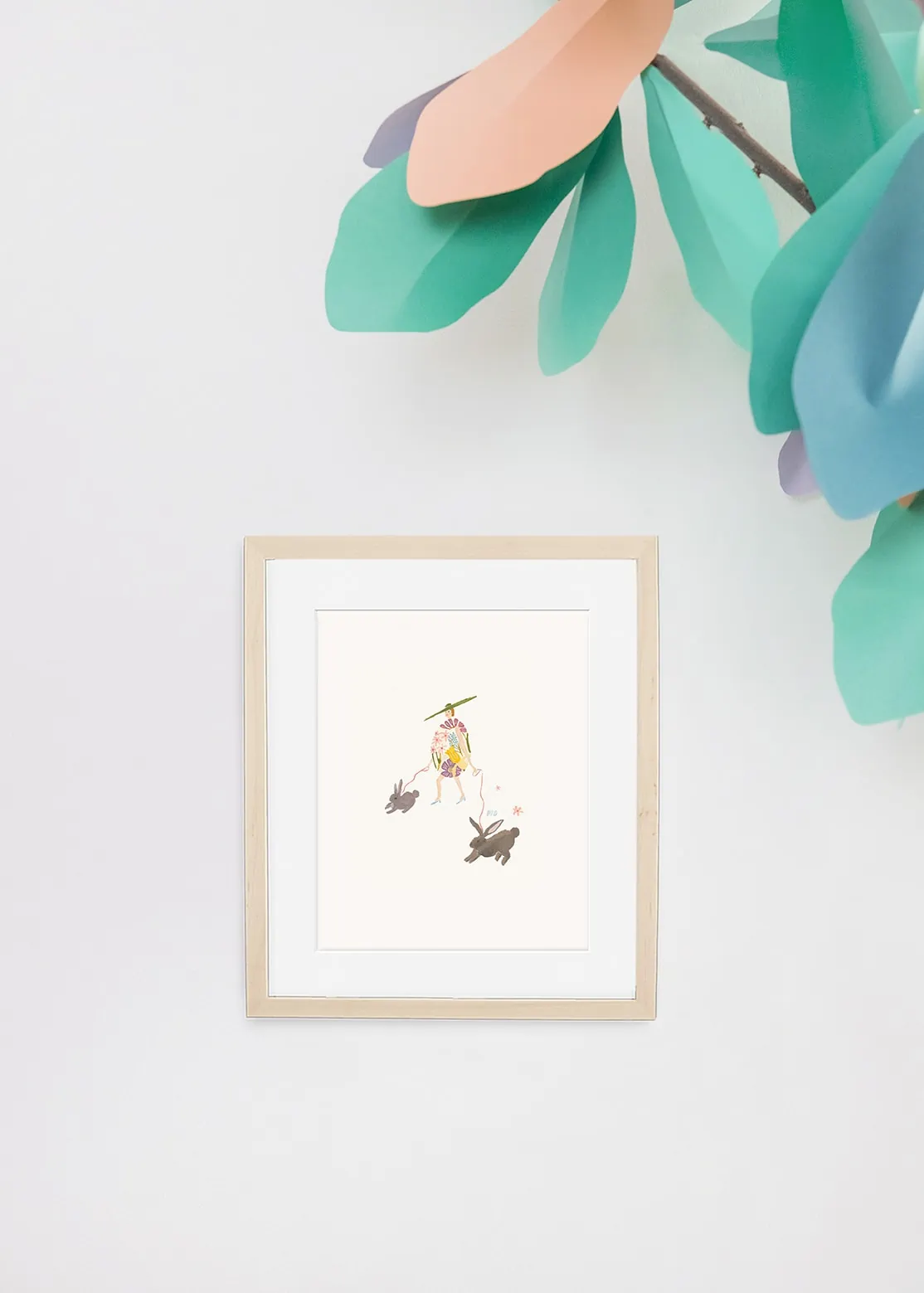 Art print of Easter Egg Lady by Monica Dorazewski on a white background with a paper tree on the side.