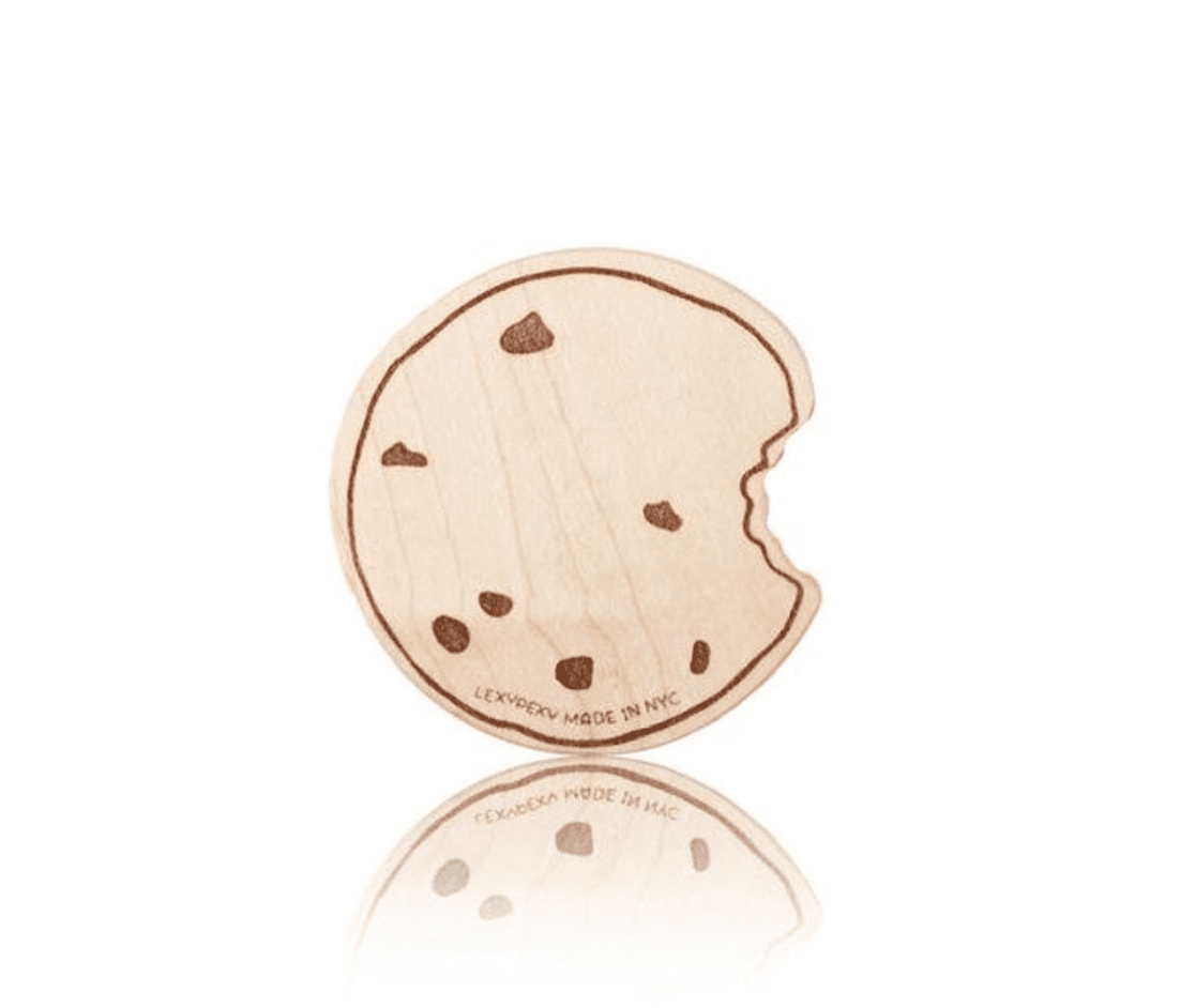 A wooden cookie teething toy on a white background. 