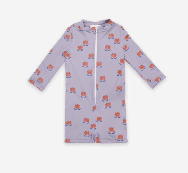 lilac-colored long sleeved swimsuit with a zip down the front and tulips printed on it 