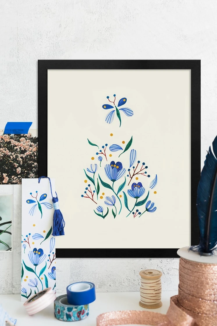 Art print of seven blue flowers by Yas Imamura in a tranquil, neutral space. 