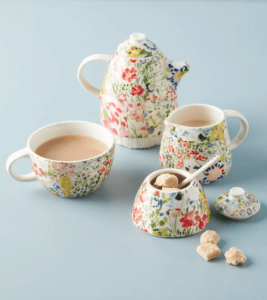 A modular floral tea set, complete with teapot, teacup, sugar bowl, and creamer