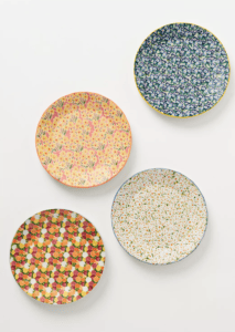 Four floral dessert plates with sweet calico-like designs