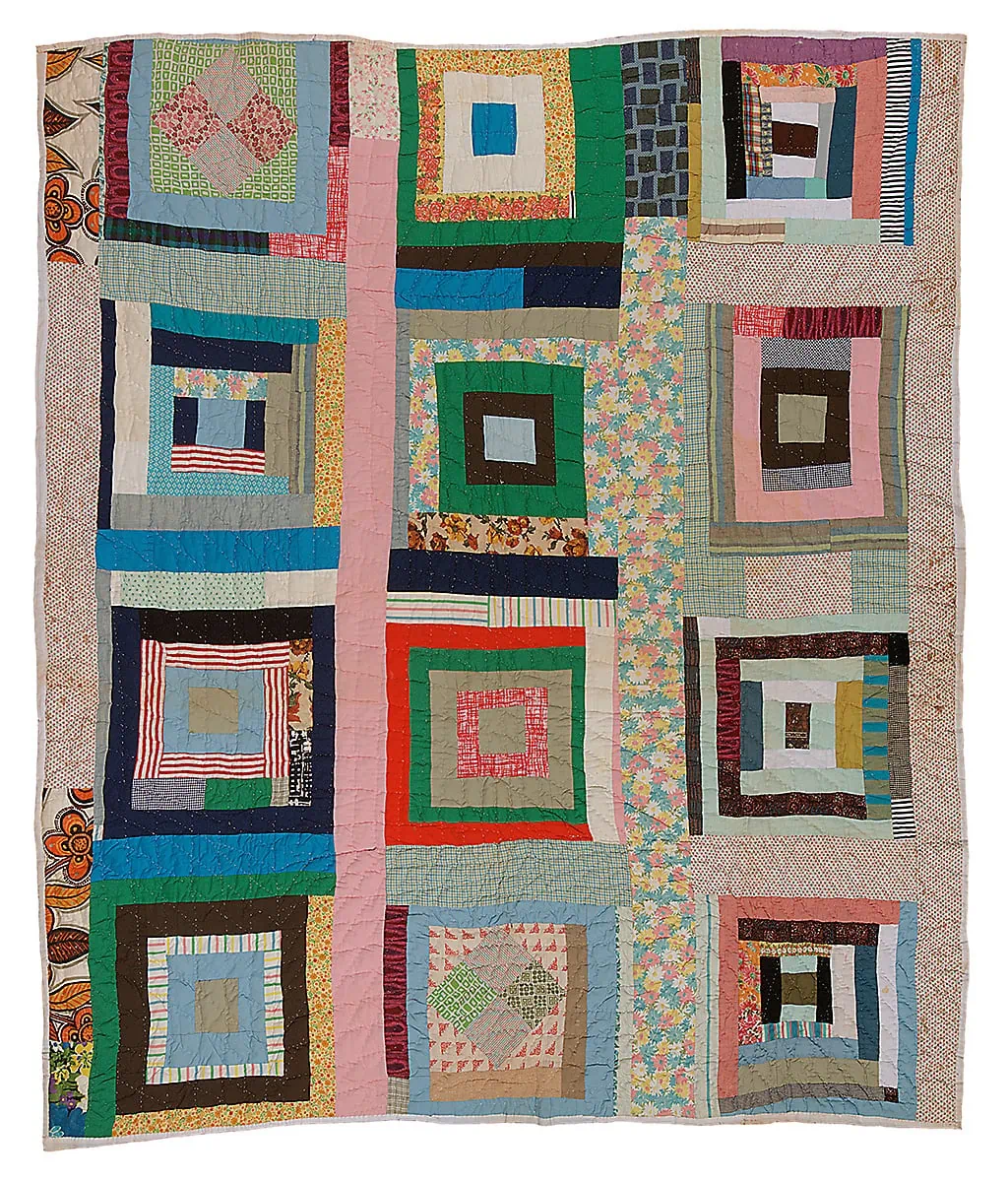 A multicolored quilt made of concentric squares and rectangles.