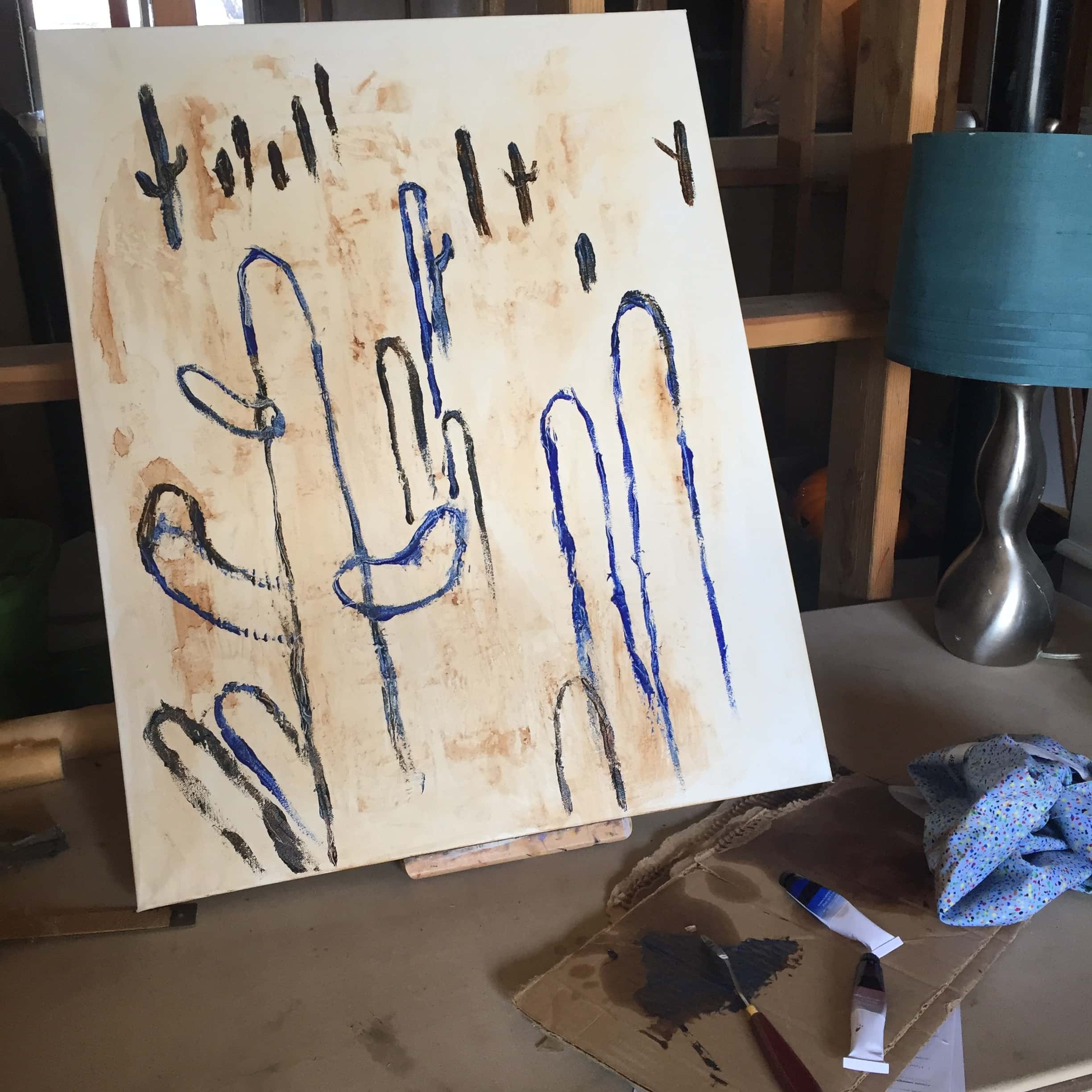 The beginnings of a painting of saguaros. 