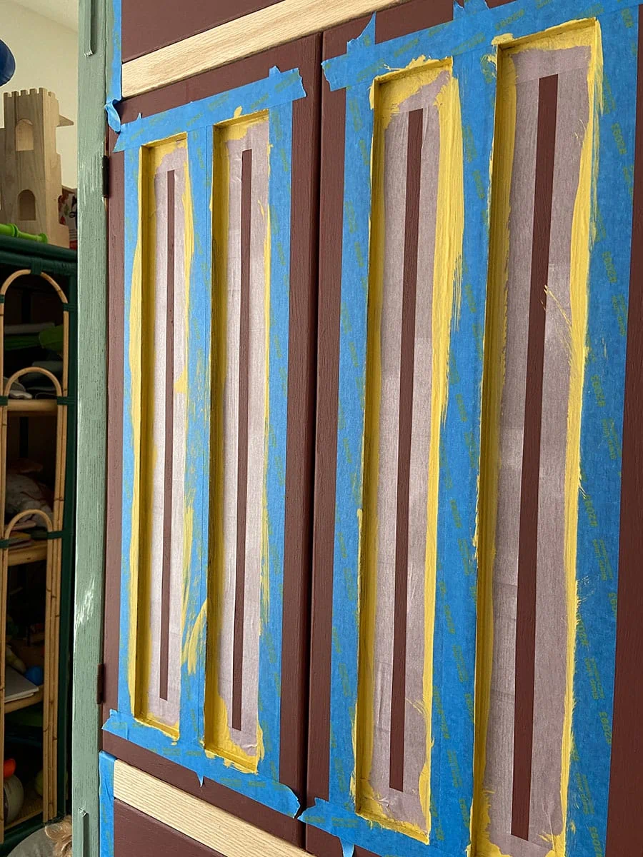 prep the cabinet with painter's tape for decorative painting 