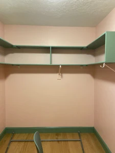 green shelves in pink closet