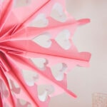 red and pink paper bag snowflakes