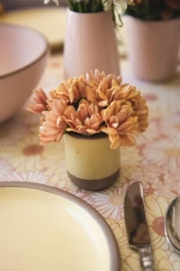 small ceramic yellow cup with mums