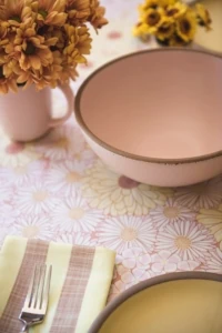 pink ceramic bowl on floral tablecloth