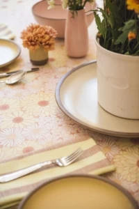 white ceramic plate and floral tablecloth