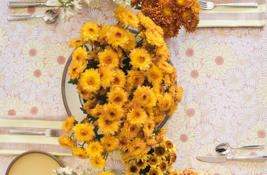 table setting overhead with fresh floral mums
