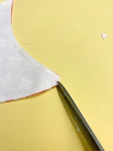 instructional photo of pattern pieces of espadrilles on yellow background