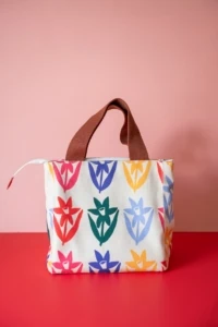 insulated lunch bag with daffodil fabric in rainbow colors