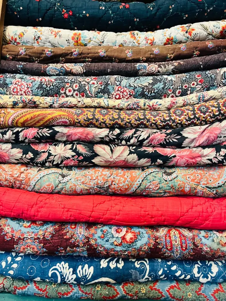 antique quilts with florals from a flea market in Paris