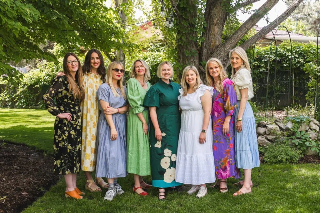 women in pretty dresses at a garden party
