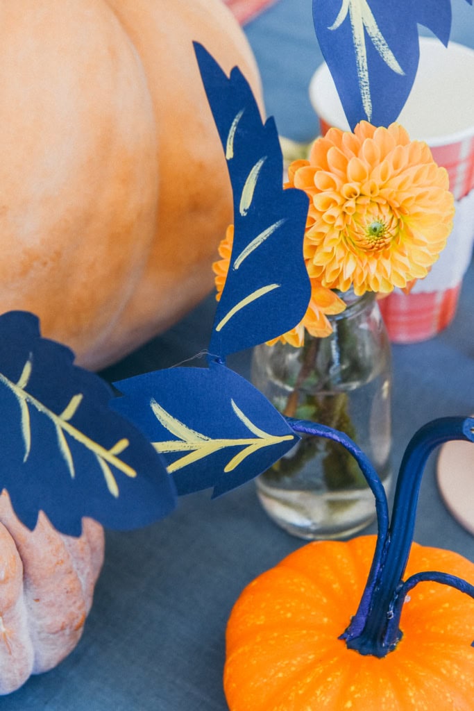 paper leaves on a pumpkin